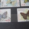 Семь марок с изображением бабочек Монголия